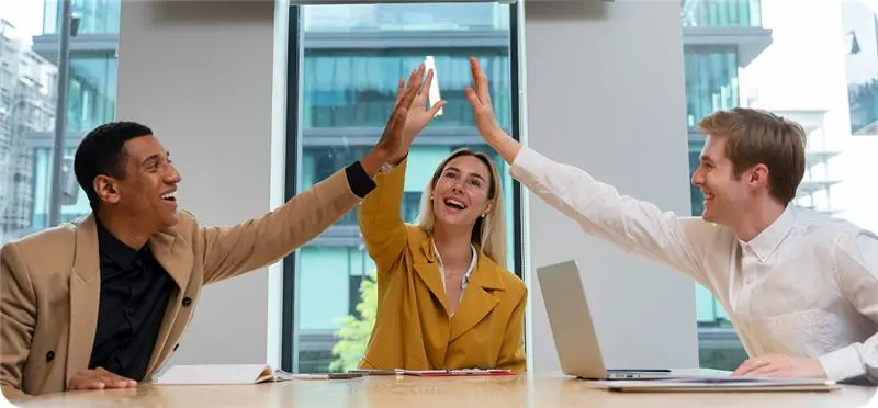 Team celebrating success and business growth with mobile apps